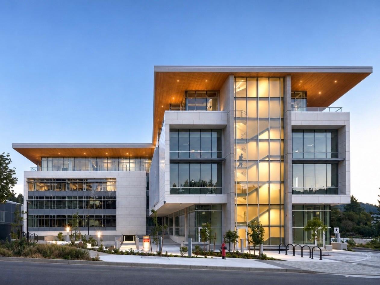 Modern glass building with illuminated stairwell
